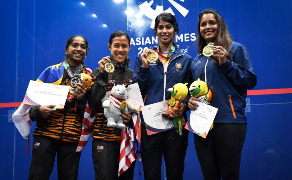 Joshna Chinappa and Dipika Pallika pose with their bronze medals won in the women's singles squash event. AFP Joshna Chinappa and Dipika Pallika pose with their bronze medals won in the women's singles squash event. AFP