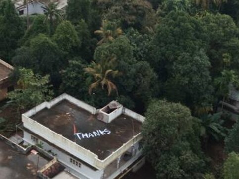 Giant ‘Thanks’ painted on roof of Kerala house from where navy evacuated two distressed women Giant ‘Thanks’ painted on roof of Kerala house from where navy evacuated two distressed women