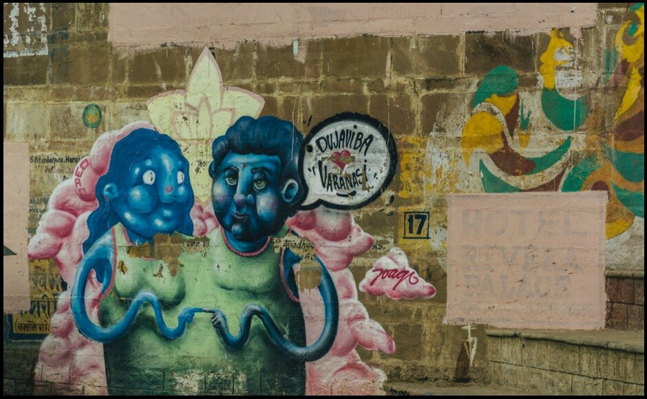 The graffiti on the walls jump out in the daylight. The bright colors and surreal patterns against the old and moss-coated havelis. The graffiti on the walls jump out in the daylight. The bright colors and surreal patterns against the old and moss-coated havelis.