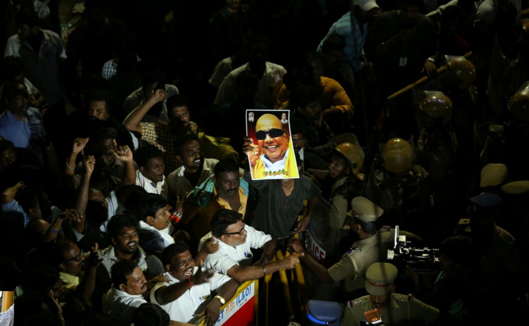 Even as the Tamil Nadu government announced a seven-day mourning period after the death of former chief minister and DMK chief M Karunanidhi on Tuesday, party workers began a violent protest outside Kauvery Hospital in Chennai, where the patriarch was being treated, after the state government rejected DMK's plea for land at the Marina Beach for Karunanidhi's memorial. Reuters Even as the Tamil Nadu government announced a seven-day mourning period after the death of former chief minister and DMK chief M Karunanidhi on Tuesday, party workers began a violent protest outside Kauvery Hospital in Chennai, where the patriarch was being treated, after the state government rejected DMK's plea for land at the Marina Beach for Karunanidhi's memorial. Reuters