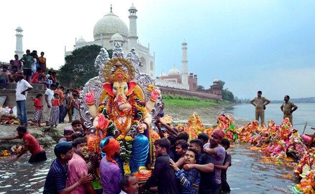 The festival is celebrated across the country. Here, devotees immerse idols of Lord Ganesha in the Yamuna river on the banks of the Taj Mahal in Agra. PTI The festival is celebrated across the country. Here, devotees immerse idols of Lord Ganesha in the Yamuna river on the banks of the Taj Mahal in Agra. PTI