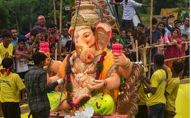 Volunteers and devotees immerse Hyderabad's most famous Khairatabad Ganesh idol, the tallest in the city at 57 feet, in the Hussain Sagar Lake. PTI Volunteers and devotees immerse Hyderabad's most famous Khairatabad Ganesh idol, the tallest in the city at 57 feet, in the Hussain Sagar Lake. PTI