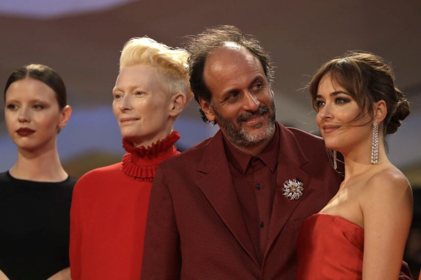 Actresses from left, Mia Goth, Tilda Swinton director Luca Guadagnino and actress Dakota Johnson pose for photographers upon arrival at the premiere of the film 'Suspiria' at the 75th edition of the Venice Film Festival in Venice, Italy, Saturday, Sept. 1, 2018. (AP Photo/Kirsty Wigglesworth)