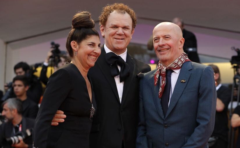 Producer Alison Dickey from left, actor John C. Reilly and director Jacques Audiard poses for photographers upon arrival at the premiere of the film 'The Sisters Brothers' at the 75th edition of the Venice Film Festival in Venice, Italy, Sunday, Sept. 2, 2018. (AP Photo/Kirsty Wigglesworth)