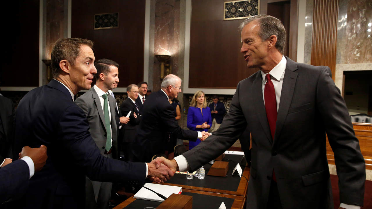 Keith Enright, chief privacy officer at Google LLC, greets Senator John Thune (R-SD) chairman of the Senate Commerce, Science and Transportation Committee before testifying on safeguards for consumer data privacy in Washington, U.S., September 26, 2018. REUTERS/Joshua Roberts - RC17C8DA7A00