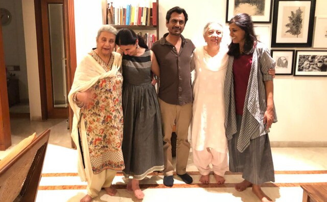 Nandita planned a walk for them around the town area to visit the places that their parents used to visit often Nandita planned a walk for them around the town area to visit the places that their parents used to visit often