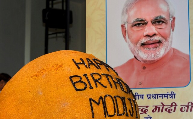 Prime Minister Narendra Modi celebrated his 68th birthday on Monday in his parliamentary constituency Varanasi in Uttar Pradesh. He is scheduled to gift many projects worth over Rs. 500 crore to the people of his parliamentary constituency on his second day of the two-day visit, on Tuesday. Union minister Prakash Javadekar unveiled a 568-kg ladoo on the occasion on Monday in New Delhi. PTI Prime Minister Narendra Modi celebrated his 68th birthday on Monday in his parliamentary constituency Varanasi in Uttar Pradesh. He is scheduled to gift many projects worth over Rs. 500 crore to the people of his parliamentary constituency on his second day of the two-day visit, on Tuesday. Union minister Prakash Javadekar unveiled a 568-kg ladoo on the occasion on Monday in New Delhi. PTI