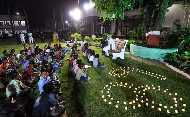 Modi interacted with the children from Kashi Vidyapith in Varanasi and spent time with them. The children gifted him cards and wished him on his birthday. PTI Modi interacted with the children from Kashi Vidyapith in Varanasi and spent time with them. The children gifted him cards and wished him on his birthday. PTI