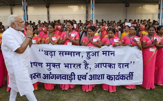 Modi also had a brief interaction with Aanganwadi workers. The women carried banners thanking the prime minister for increasing their daily wages. He mingled with them enquired about their work and families and also told them that they should become "Yashoda Maiyya" for thousands of children who need attention and better healthcare. PTI Modi also had a brief interaction with Aanganwadi workers. The women carried banners thanking the prime minister for increasing their daily wages. He mingled with them enquired about their work and families and also told them that they should become "Yashoda Maiyya" for thousands of children who need attention and better healthcare. PTI