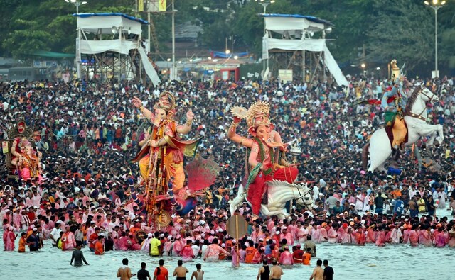 Devotees carried Ganesha idols of all sizes for immersion in the Arabian Sea at Mumbai's Girgaum Chowpatty, one of the prime locations for immersions in the city, besides Juhu Beach, Powai Lake and Dadar Chowpatty. PTI Devotees carried Ganesha idols of all sizes for immersion in the Arabian Sea at Mumbai's Girgaum Chowpatty, one of the prime locations for immersions in the city, besides Juhu Beach, Powai Lake and Dadar Chowpatty. PTI