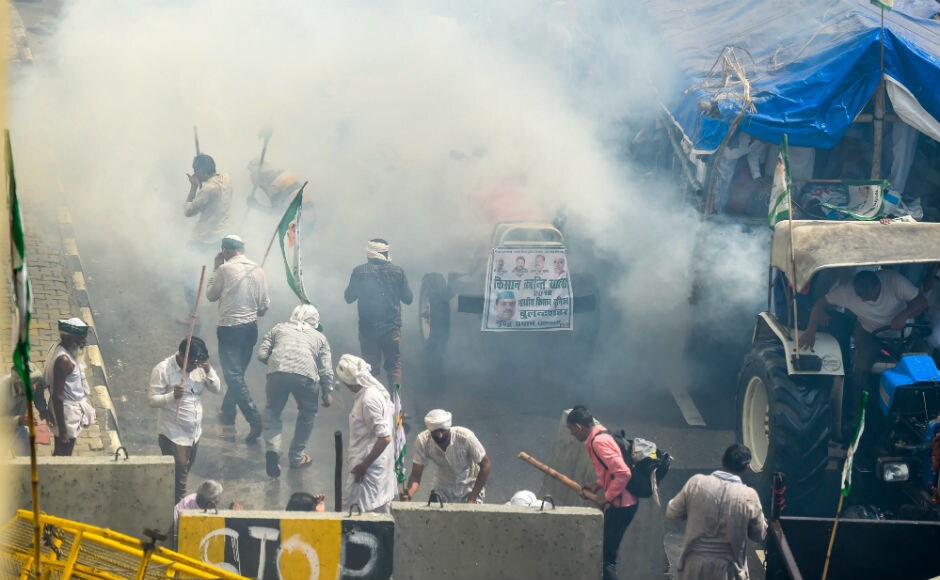 Farmers turned violent when the police charged them with water cannons and tear gas. Congress condemned this said that it was shameful that this was happening on the day of Gandhi Jayanti. PTI Farmers turned violent when the police charged them with water cannons and tear gas. Congress condemned this said that it was shameful that this was happening on the day of Gandhi Jayanti. PTI
