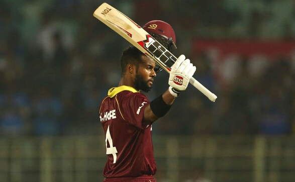 Shai Hope raises his bat in celebration after bringing up his century. AP Shai Hope raises his bat in celebration after bringing up his century. AP