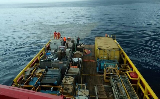 Workers of PT Pertamina stand onboard Prabu ship as they watch what is believed to be debris from the crashed Lion Air flight JT610, off the shore of Karawang regency. Reuters Workers of PT Pertamina stand onboard Prabu ship as they watch what is believed to be debris from the crashed Lion Air flight JT610, off the shore of Karawang regency. Reuters