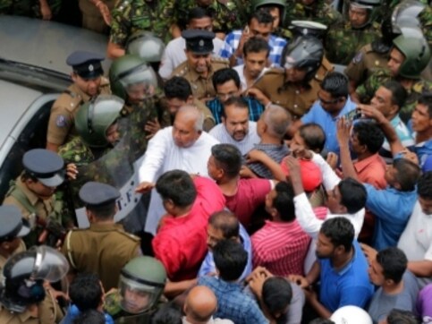 Sri Lanka crisis: One dead, two injured in clashes as Mahinda Rajapaksa's supporters try to take minister hostage Sri Lanka crisis: One dead, two injured in clashes as Mahinda Rajapaksa's supporters try to take minister hostage