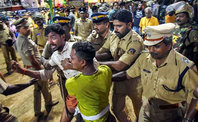 As the devotees continued to stay put despite repeated requests from the police, action was initiated to forcefully evict them from the premises. PTI As the devotees continued to stay put despite repeated requests from the police, action was initiated to forcefully evict them from the premises. PTI