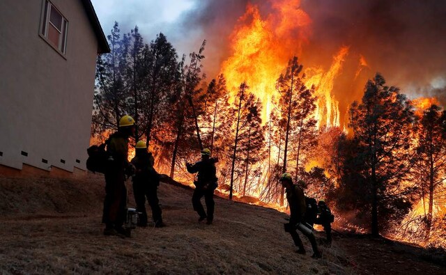 Wildfires raged in parts of California. A group of US Forest Service firefighters monitor a back fire while battling to save homes at Paradise, California. Reurters Wildfires raged in parts of California. A group of US Forest Service firefighters monitor a back fire while battling to save homes at Paradise, California. Reurters
