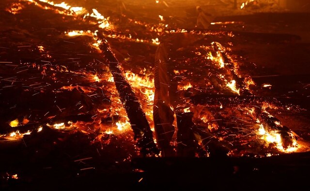 Wind-driven ambers were seen during the Camp Fire in California's Paradise town. Reuters Wind-driven ambers were seen during the Camp Fire in California's Paradise town. Reuters