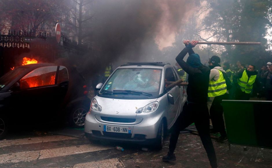 Pockets of demonstrators built makeshift barricades in the middle of Paris streets, lit fires, torched cars and trash cans, threw rocks at police and smashed and looted stores. AP Pockets of demonstrators built makeshift barricades in the middle of Paris streets, lit fires, torched cars and trash cans, threw rocks at police and smashed and looted stores. AP