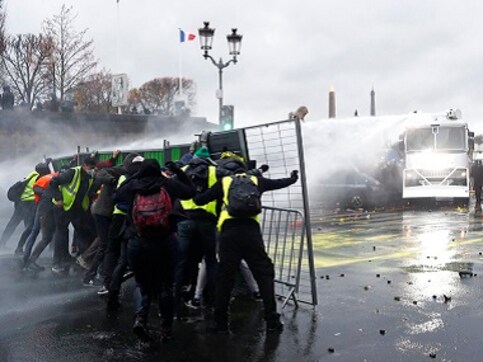 France agitation: Tear gas, water cannons used to disperse mob protesting rising taxes; 63 arrested in Paris France agitation: Tear gas, water cannons used to disperse mob protesting rising taxes; 63 arrested in Paris