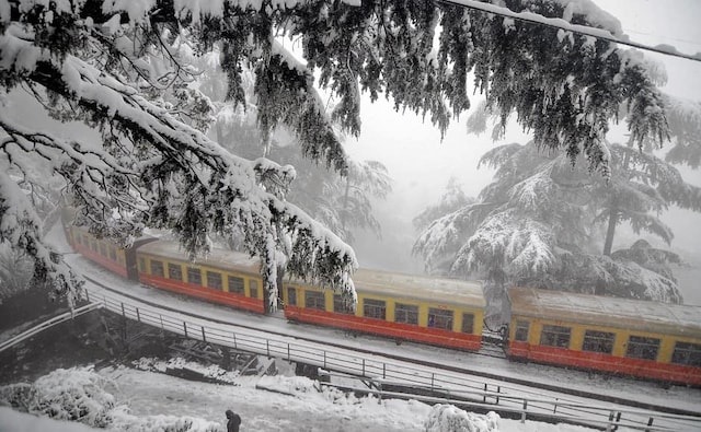 While there were some reports of buses getting stuck in heavy snowfall between Kufri and Chharabra, seen here is a train in Shimla. PTI While there were some reports of buses getting stuck in heavy snowfall between Kufri and Chharabra, seen here is a train in Shimla. PTI
