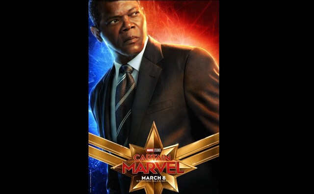 Digitally de-aged Nick Fury arrives in a stylish suit. The character is played by Samuel L Jackson. Digitally de-aged Nick Fury arrives in a stylish suit. The character is played by Samuel L Jackson.