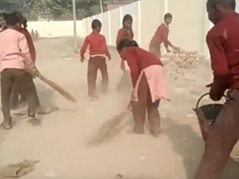Students of this government school in UP's Chiraigaon village forced to clean their school premises Students of this government school in UP's Chiraigaon village forced to clean their school premises