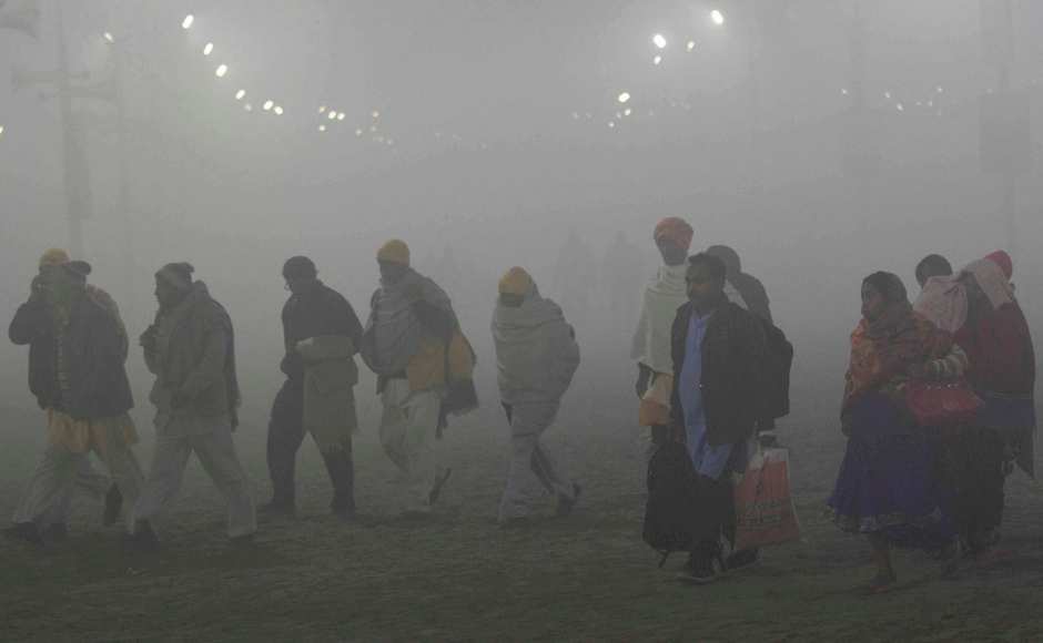 Devotees arrive at Sangam on the occasion of 'Paush Purnima'. PTI Devotees arrive at Sangam on the occasion of 'Paush Purnima'. PTI