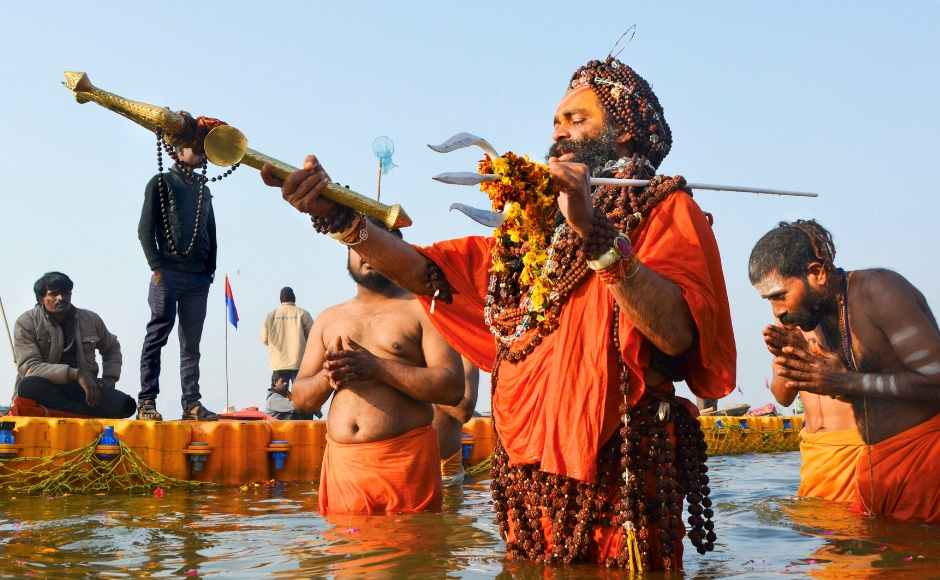 A sadhu holds a trident as he takes a holy dip at Sangam on the occasion of 'Paush Purnima'. PTI A sadhu holds a trident as he takes a holy dip at Sangam on the occasion of 'Paush Purnima'. PTI