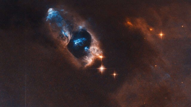 NASA's Hubble captures haunting glimpse of bright blue cluster of objects in space NASA's Hubble captures haunting glimpse of bright blue cluster of objects in space