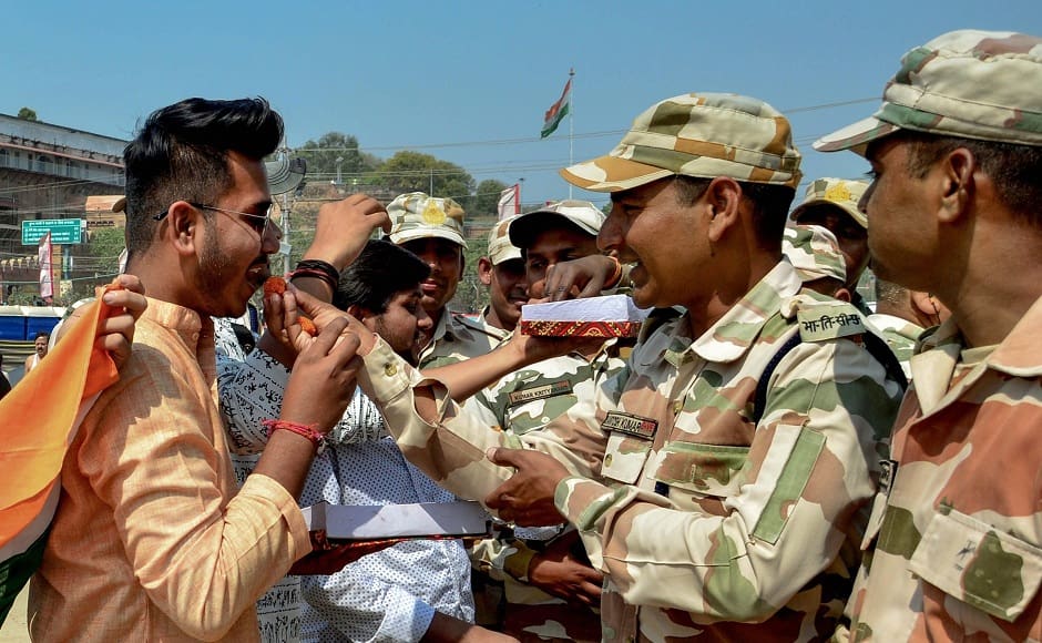 In Allahabad, people exchanged sweets with paramilitary personnel when news of the IAF strikes across the LoC spread. PTI In Allahabad, people exchanged sweets with paramilitary personnel when news of the IAF strikes across the LoC spread. PTI