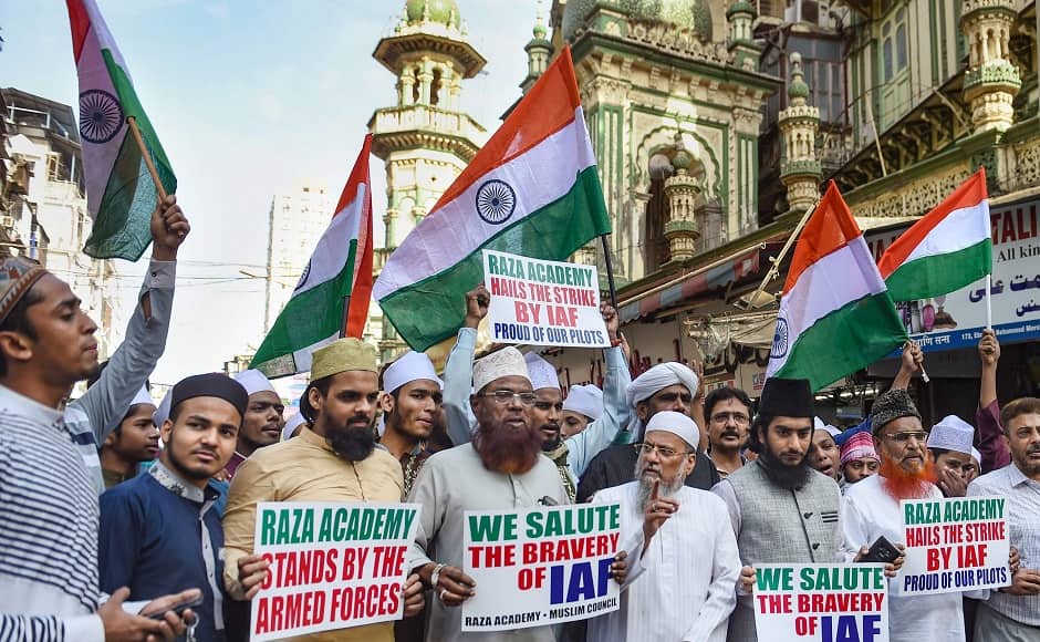 Members of Mumbai's Raza Academy gathered to celebrate the mission's success. They stood waving tricolours and holding placards with messages like 'We salute the bravery of IAF'. PTI Members of Mumbai's Raza Academy gathered to celebrate the mission's success. They stood waving tricolours and holding placards with messages like 'We salute the bravery of IAF'. PTI