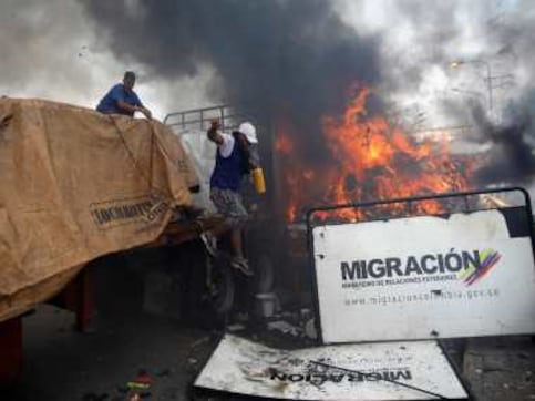 Venezuela: Two killed as Maduro loyalists block aid convoy with tear gas, bullets; Guaido says president doesn't care for citizens Venezuela: Two killed as Maduro loyalists block aid convoy with tear gas, bullets; Guaido says president doesn't care for citizens