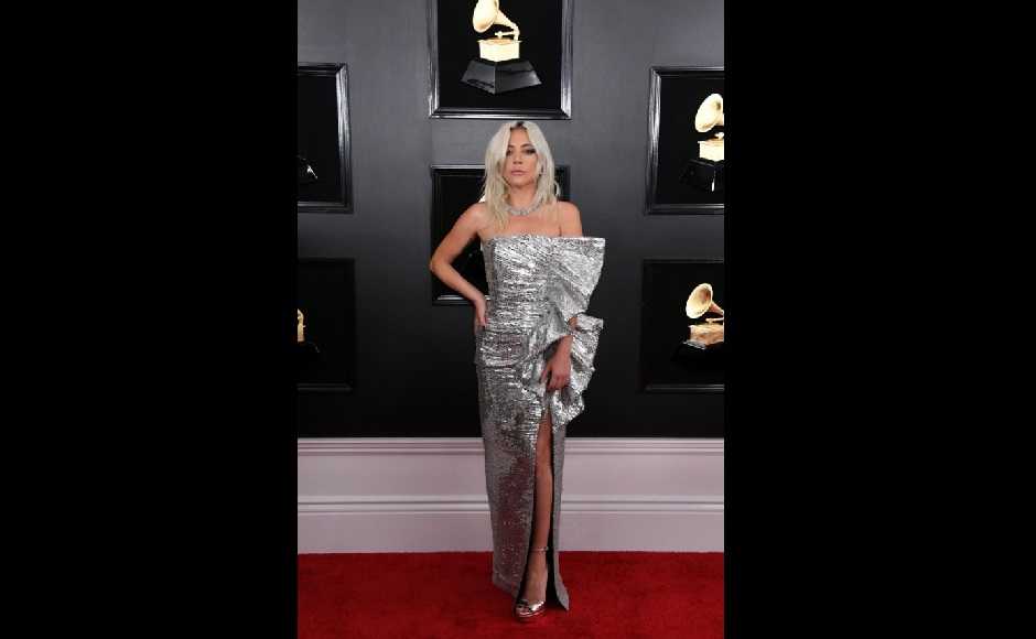 Lady Gaga wore a silver Celine dress. Image from Twitter @THEIMONATION Lady Gaga wore a silver Celine dress. Image from Twitter @THEIMONATION