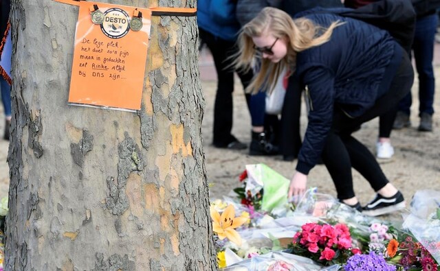 A sign around a tree reads, "The empty space, it hurts so much, but Rinke will be always with us in our thoughts", referring to one of three victims. Reuters A sign around a tree reads, "The empty space, it hurts so much, but Rinke will be always with us in our thoughts", referring to one of three victims. Reuters