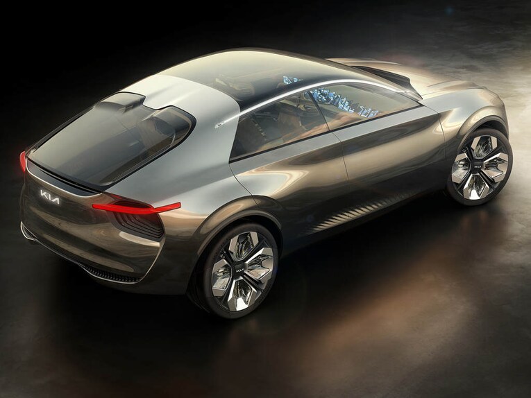 The Kia Imagine EV crossover sports 22-inch alloy wheels that have plexiglass elements. It has a panoramic sunroof that is cut off by a sharp-angled line. The Kia Imagine EV crossover sports 22-inch alloy wheels that have plexiglass elements. It has a panoramic sunroof that is cut off by a sharp-angled line.