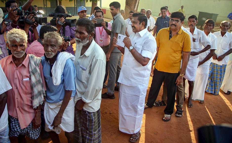 Tamil Nadu Chief Minister Edappadi K Palaniswami waited in a queue to cast his vote at a polling booth in Salem. The state also saw bypolls to 18 Assembly constituencies. PTI Tamil Nadu Chief Minister Edappadi K Palaniswami waited in a queue to cast his vote at a polling booth in Salem. The state also saw bypolls to 18 Assembly constituencies. PTI