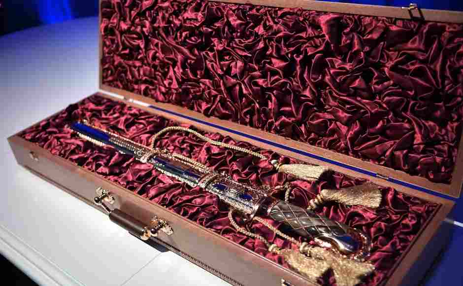 Kim presented Putin a traditional Korean sword, while the Russian leader gave the diminutive dictator a saber, as well as a tea set suitable for use on his armored train. AFP Kim presented Putin a traditional Korean sword, while the Russian leader gave the diminutive dictator a saber, as well as a tea set suitable for use on his armored train. AFP