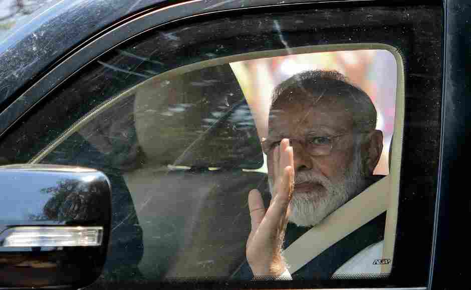 Modi was seen waving as he leaves after filing his nomination papers in Varanasi. Before filing his nomination, he offered prayers at a temple. AFP Modi was seen waving as he leaves after filing his nomination papers in Varanasi. Before filing his nomination, he offered prayers at a temple. AFP