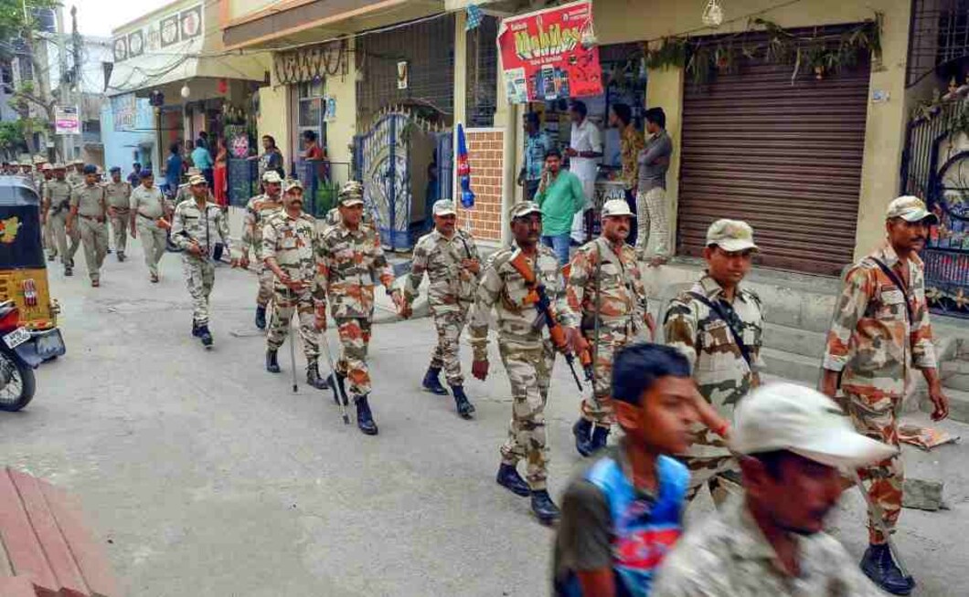 Security forces personnel march in a street at Uppaguda in Hyderabad on Wednesday, a day before phase-I of 2019 Lok Sabha elections. PTI Security forces personnel march in a street at Uppaguda in Hyderabad on Wednesday, a day before phase-I of 2019 Lok Sabha elections. PTI