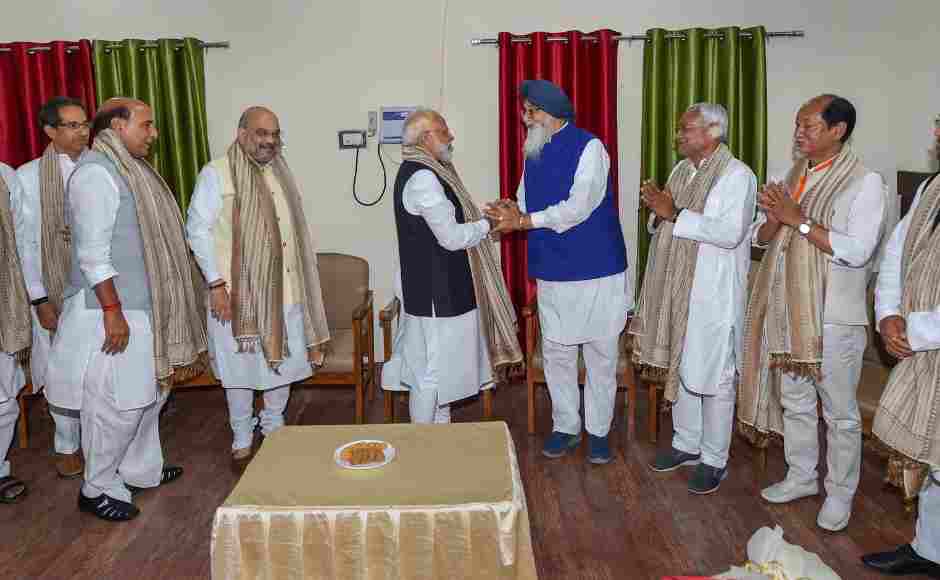 Narendra Modi was greeted by Shiromani Akali Dal President Parkash Singh Badal and other NDA leaders before his nomination filing ahead of the 2019 general elections at the Collector's office in Varanasi. PTI Narendra Modi was greeted by Shiromani Akali Dal President Parkash Singh Badal and other NDA leaders before his nomination filing ahead of the 2019 general elections at the Collector's office in Varanasi. PTI