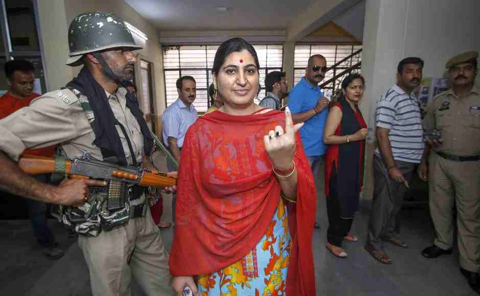 A migrant Kashmiri Pandit woman shows her inked finger after she cast her vote for Anantnag parliamentary seat. PTI A migrant Kashmiri Pandit woman shows her inked finger after she cast her vote for Anantnag parliamentary seat. PTI
