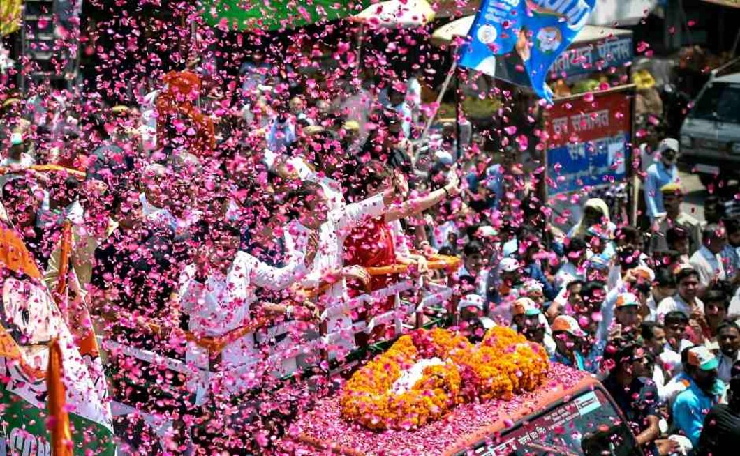 Supporters shower flowers on Congress President Rahul Gandhi's roadshow, before filing the nomination papers for Amethi Lok Sabha seat on Wednesday. PTI Supporters shower flowers on Congress President Rahul Gandhi's roadshow, before filing the nomination papers for Amethi Lok Sabha seat on Wednesday. PTI