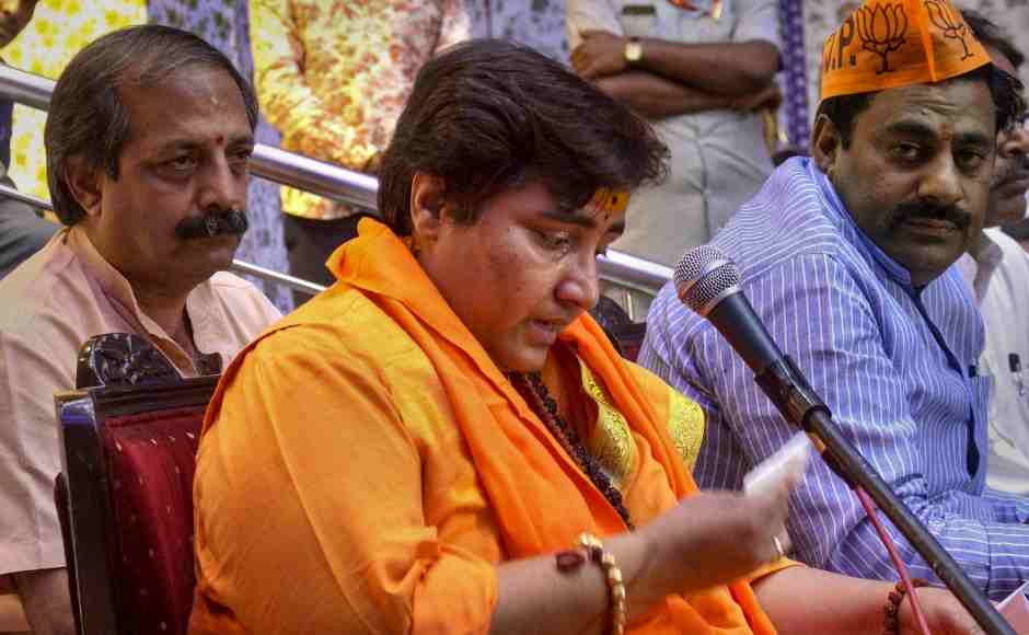 BJP candidate Sadhvi Pragya Singh Thakur reacts while addressing a party workers' meeting for Lok Sabha polls in Bhopal. She courted controversy on Friday by saying that IPS officer Hemant Karkare died in 26/11 Mumbai terror attacks as she had cursed him. PTI BJP candidate Sadhvi Pragya Singh Thakur reacts while addressing a party workers' meeting for Lok Sabha polls in Bhopal. She courted controversy on Friday by saying that IPS officer Hemant Karkare died in 26/11 Mumbai terror attacks as she had cursed him. PTI
