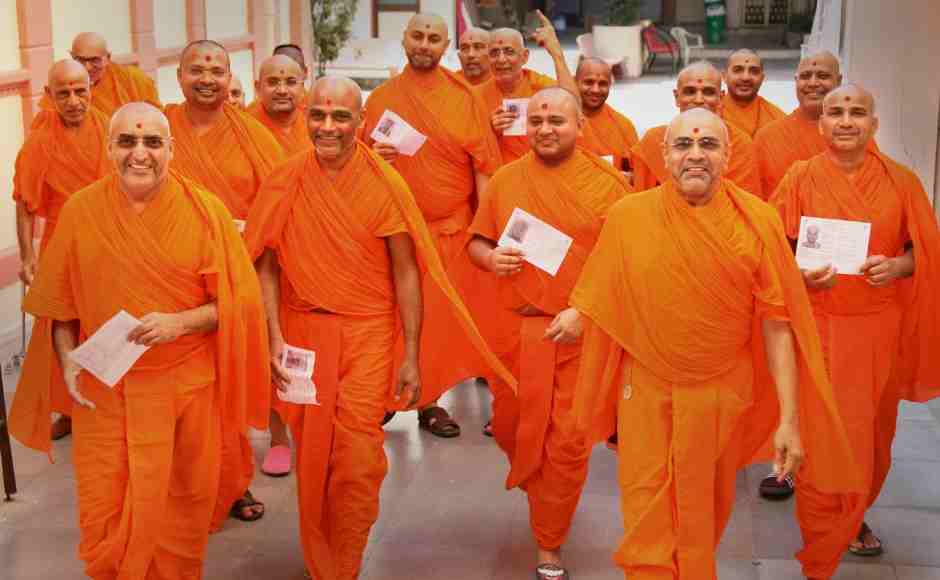 Swaminarayan saints after casting their votes at a polling station in Ahmedabad. PTI Swaminarayan saints after casting their votes at a polling station in Ahmedabad. PTI