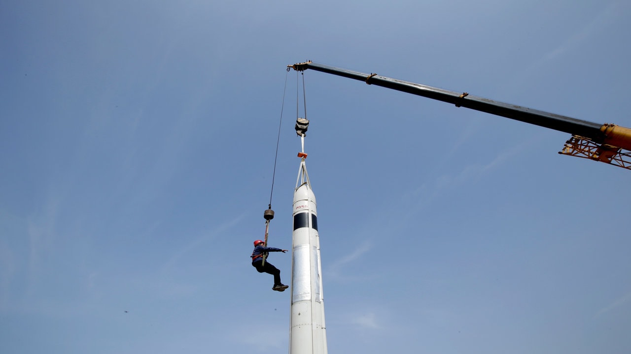 Co-founder and engineer Wu Xiaofei prepares for a test launch of LinkSpace's reusable rocket RLV-T5, also known as NewLine Baby, on a vacant plot of land near the company's development site in Longkou, Shandong province. Image credit; Reuters