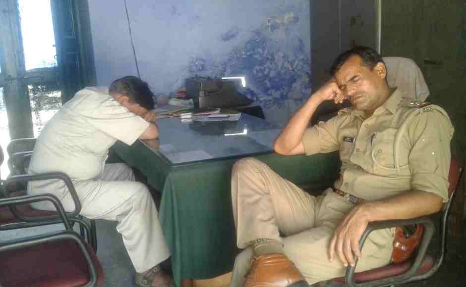 Policemen grab some rest during election duty at a booth in Rampur. Shannu Khan/101Reporters Policemen grab some rest during election duty at a booth in Rampur. Shannu Khan/101Reporters