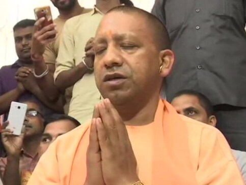 Yogi Adityanath visits temple despite Election Commission's 72-hour ban barring him from poll campaign Yogi Adityanath visits temple despite Election Commission's 72-hour ban barring him from poll campaign