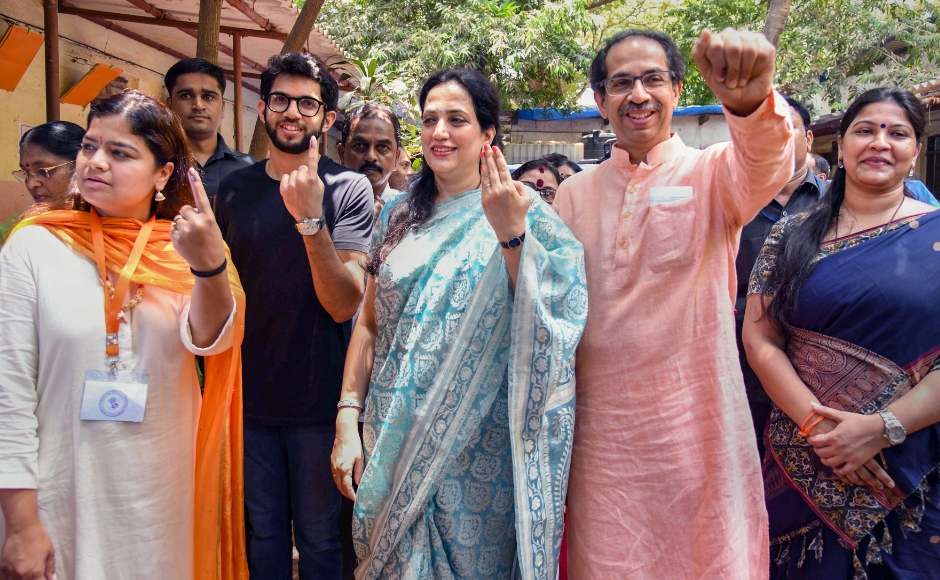 Shiv Sena President Uddhav Thackeray, wife Rashmi Thackeray, son Aditya Thackeray and BJP candidate Poonam Mahajan posed for mediapersons after casting their ballots on Monday. PTI Shiv Sena President Uddhav Thackeray, wife Rashmi Thackeray, son Aditya Thackeray and BJP candidate Poonam Mahajan posed for mediapersons after casting their ballots on Monday. PTI