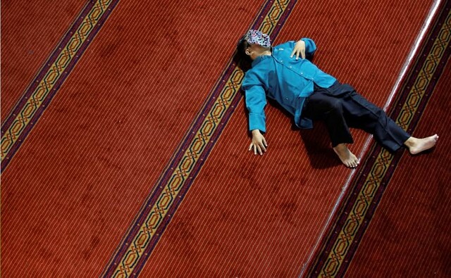 A man takes a rest as he waits for Iftar during Ramadan at the Istiqlal mosque in Jakarta, Indonesia. At the end of the month of Ramadan, there will be a three-day celebration called Eid al-Fitr or the Festival of the Breaking of the Fast, which starts with a sighting of the new moon. Reuters/Willy Kurniawan. A man takes a rest as he waits for Iftar during Ramadan at the Istiqlal mosque in Jakarta, Indonesia. At the end of the month of Ramadan, there will be a three-day celebration called Eid al-Fitr or the Festival of the Breaking of the Fast, which starts with a sighting of the new moon. Reuters/Willy Kurniawan.