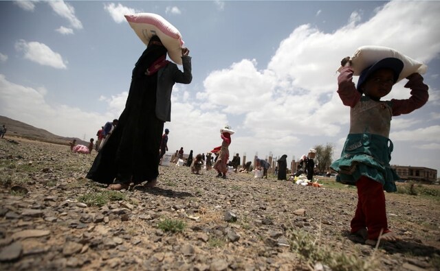 A girl carries food aid she received from the local charity, Mona Relief, ahead of the holy month of Ramadan on the outskirts of Sanaa, Yemen on 5 May, 2019. Mona Relief is the Yemen Organisation for Humanitarian Relief and Development. Reuters/Khaled Abdullah. A girl carries food aid she received from the local charity, Mona Relief, ahead of the holy month of Ramadan on the outskirts of Sanaa, Yemen on 5 May, 2019. Mona Relief is the Yemen Organisation for Humanitarian Relief and Development. Reuters/Khaled Abdullah.